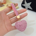 Sparkling pink heart-shaped keychain with gold hardware and rhinestone leather strap - Pink