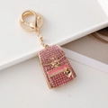 Pink rhinestone backpack keychain with gold metal frame and heart pendant charm - Pink