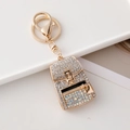 Golden backpack keychain with heart pendant and white shimmering crystals - White