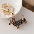 Sparkling dachshund keychain featuring dark grey rhinestones on a gold alloy frame - Gun Black
