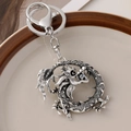 Antique silver zodiac dragon keychain with central bead and metal ring clasp - Silver