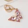 Golden butterfly keychain pendant featuring sparkling pink crystals and rhinestones - Pink