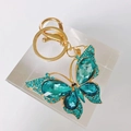 Golden butterfly keychain with teal crystals and rhinestones on a metal lobster clasp - Blue