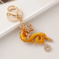 Portachiavi drago cinese dorato con smalto giallo e strass brillanti decorativi - Oro