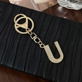 Golden alloy letter U keychain with sparkling rhinestones and lobster clasp accessory - Letter U