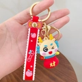 Cute yellow dragon keychain in red lucky bag with red silicone strap and gold ring - Prosperous Wealth