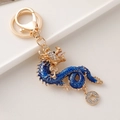 Golden dragon keychain with blue enamel and sparkling rhinestones on an alloy base - Blue