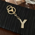 Golden alloy letter Y keychain pendant with sparkling white rhinestones and metal clasp - Letter Y