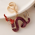 Exquisite gold dragon keychain with purple resin and sparkling crystals for bag decor - Purple