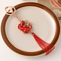 Traditionele Chinese geluksdier sleutelhanger met kralenkwastje en goud accent - Pixiu