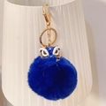 Portachiavi con leone danzante blu, chiusura in metallo dorato e pompon di pelliccia - Blu