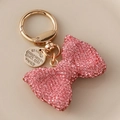 Schlüsselanhänger mit rosa Strass-Schleife und goldener Metallfeder für Taschen - Rosa