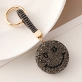 Portachiavi con faccina sorridente in strass grigi e neri e cinturino in cristallo - Grigio