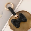 Funkelnder schwarzer Strass-Schleifen-Schlüsselanhänger mit goldenem Ringverschluss - Schwarz
