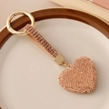 Elegant champagne gold heart keychain featuring full rhinestones and leather strap charm - Champagne