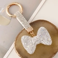 Funkelnder Strass Schleife Schlüsselanhänger mit goldenem Ring und Diamant Handschlaufe - Weiß