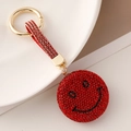 Portachiavi con faccina sorridente in strass rossi e anello dorato per borse - Rosso