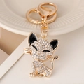 Goldener Katzen-Schlüsselanhänger mit funkelnden Kristallsteinen für Damenhandtaschen - Goldene Katze