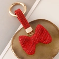 Funkelnder roter Strass-Schleifen-Schlüsselanhänger mit goldenem Federringverschluss - Rot