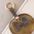 Funkelnder dunkelgrauer Strass-Schleifen-Schlüsselanhänger mit goldenem Verschluss für Taschen - Grau