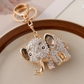 Portachiavi a forma di elefante dorato con strass brillanti su piatto di ceramica - Bianco
