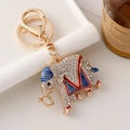 Porte-clés éléphant doré avec strass blancs et détails en émail rouge et bleu - Bleu
