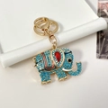 Portachiavi a forma di elefante con strass blu e finitura dorata con gemma rossa - Blu