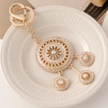 Elegant gold dreamcatcher keychain with sparkling rhinestones and tiered round pendants - Round White