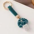 Funkelnder dunkelblauer Strass-Pilz Schlüsselanhänger mit Goldring und Kristallarmband - Tintenblau