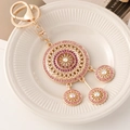 Champagne gold dreamcatcher keychain with purple and pink crystals for handbags - Round Pink