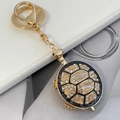 Goldener Schildkröten-Schlüsselanhänger mit gelbem Edelstein und Kristall-Anhänger - Schwarz Weiß