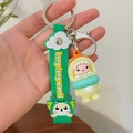 Cute green dragon silicone keychain with a cartoon doll and Long Teng Wan Li strap - Yellow Hat