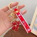 Porte-clés PiXiu rouge avec finition émail doré et dragonne en silicone mignon accessoire - Pi Xiu