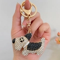 Portachiavi a forma di cane con strass neri e bianchi su base in metallo dorato - Nero