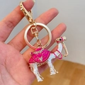 Golden camel keychain with pink and white enamel, sparkling rhinestones and horseshoe ring - Rose Red