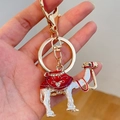Red and white enamel camel keychain with sparkling rhinestones and gold ring - Red