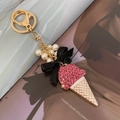 Portachiavi gelato con strass rosa, fiocco nero e perle bianche su metallo dorato - Nero rosa