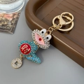 Golden Chinese zodiac snake keychain with blue crystals and lucky fortune coin pendant - Blue