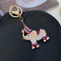 Gouden Thailand olifant sleutelhanger met witte kristallen en paarse emaille accenten - Wit
