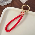 Roter geflochtener Leder-Schlüsselanhänger mit goldenem Ring und Cai-Emblem - Mit Ring Stil / Rot