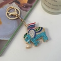 Gouden olifant sleutelhanger met blauwe strassteentjes en Thailand vlag hanger - Blauw