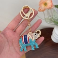 Blue rhinestone elephant keychain in gold finish with Thailand lettering and lobster clasp - Blue