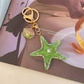 Starfish keychain with green resin starfish, colored rhinestones and shell pendant - Green