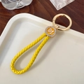 Yellow braided leather keychain with golden lucky charm and sparkling rhinestones - With Ring Style / Yellow