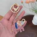 Pink rhinestone elephant keychain with gold metal finish and Thailand text tag - Pink
