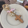 Exquisite cross keychain with champagne rhinestones, pink ribbon bow, and pearls - Champagne
