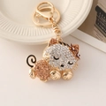 Golden cat keychain with champagne rhinestones and lobster clasp for handbags - Champagne