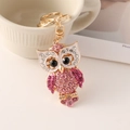 Pink and purple rhinestone-studded owl keychain in polished gold-plated alloy - Pink
