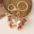 Colorful crystal butterfly keychain with golden metal finish and white resin wings - White