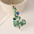 Portachiavi serpente vintage dorato con smalto verde e cristalli su una ciotola - Verde